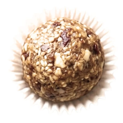 Cashew peanut butter date ball rolled in crushed nuts